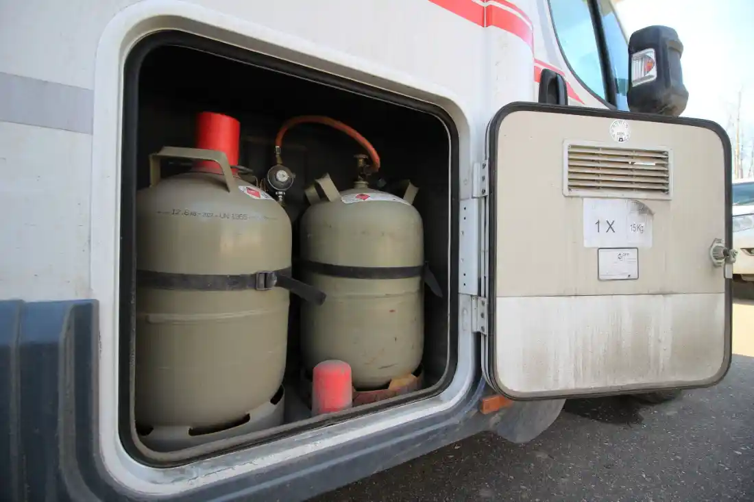 Two Propane tanks in an RV storage compartment